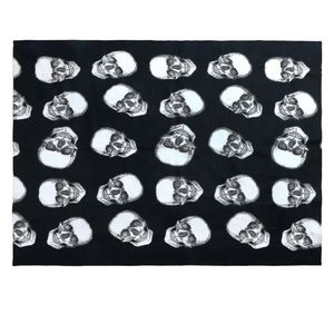 Studio 3B Halloween Skull Throw Blanket in Jet Set/Coconut Milk Factory Wrapped